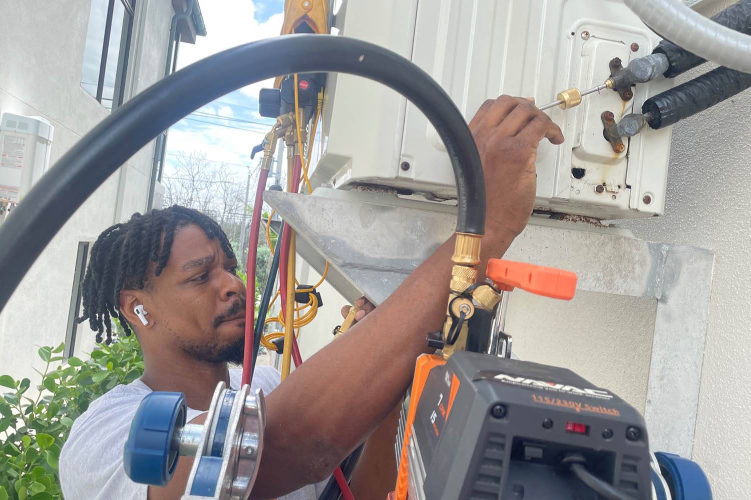 Mabry Brothers HVAC Technician working on A/C line