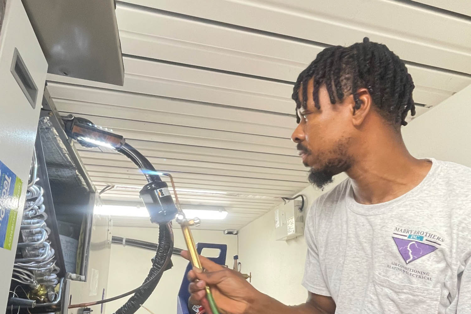 Mabry HVAC technician brazing air conditioning lines