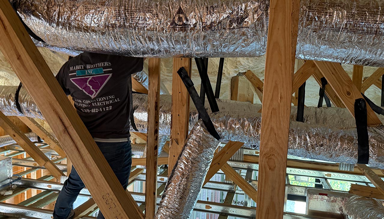 Mabry Employee working on ductwork