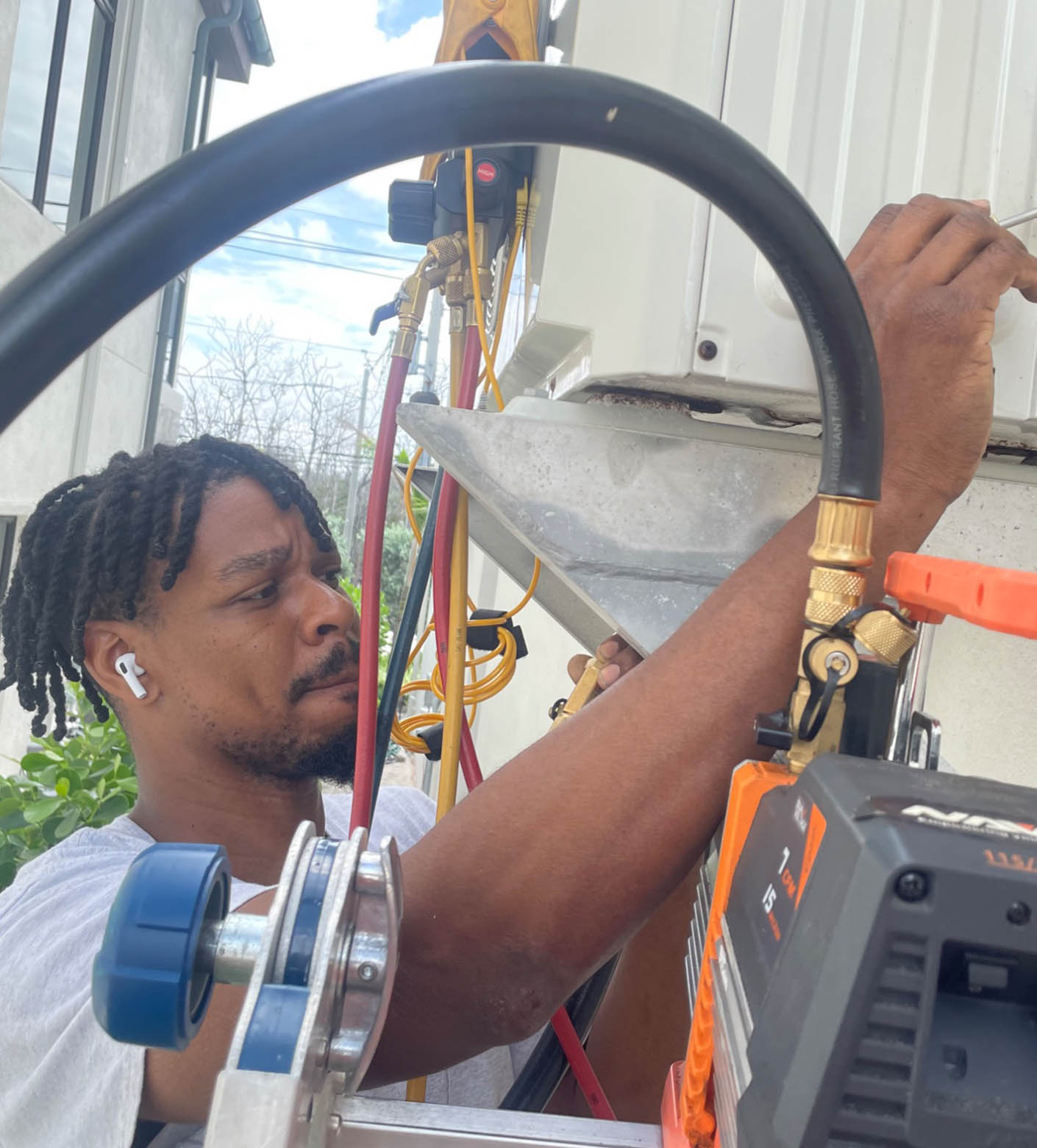 Mabry brothers employee servicing air conditioning unit